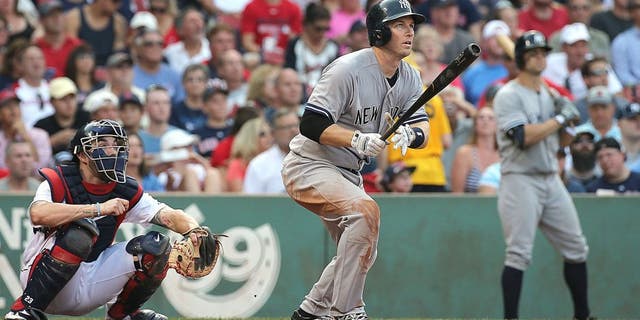 BOSTON, MA - SEPTEMBER 2: Stephen Drew #14 of the New York Yankees hits a three-run home run in the third inning against he Boston Red Sox at Fenway Park on September 2, 2015 in Boston, Massachusetts. (Photo by Jim Rogash/Getty Images)