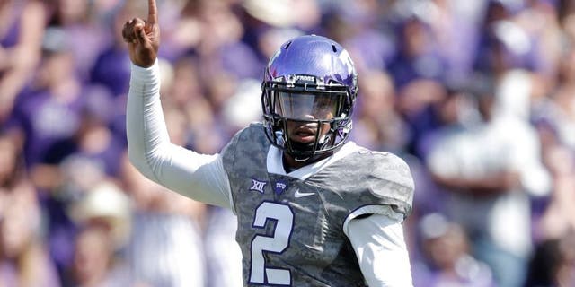 Oct 3, 2015; Fort Worth, TX, USA; Texas Christian University Horned Frogs quarterback Trevone Boykin (2) celebrates a first down against the University of Texas Longhorns in the third quarter at Amon G. Carter Stadium. Mandatory Credit: Erich Schlegel-USA TODAY Sports