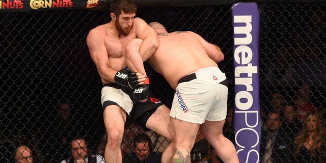 HOUSTON, TX - OCTOBER 03: (L-R) Ruslan Magomedov attempts to submit Shawn Jordan in their heavyweight bout during the UFC 192 event at the Toyota Center on October 3, 2015 in Houston, Texas. (Photo by Josh Hedges/Zuffa LLC/Zuffa LLC via Getty Images)