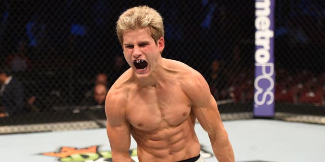 HOUSTON, TX - OCTOBER 03: Sage Northcutt celebrates his victory over Francisco Trevino in their lightweight bout during the UFC 192 event at the Toyota Center on October 3, 2015 in Houston, Texas. (Photo by Josh Hedges/Zuffa LLC/Zuffa LLC via Getty Images)
