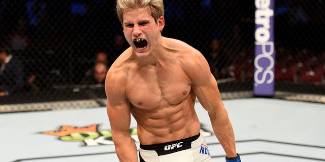 HOUSTON, TX - OCTOBER 03: Sage Northcutt celebrates his victory over Francisco Trevino in their lightweight bout during the UFC 192 event at the Toyota Center on October 3, 2015 in Houston, Texas. (Photo by Josh Hedges/Zuffa LLC/Zuffa LLC via Getty Images)