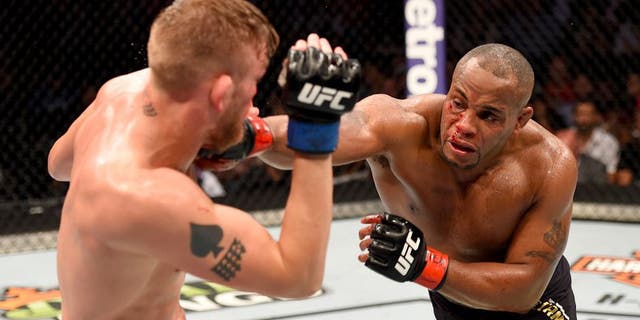 HOUSTON, TX - OCTOBER 03: (R-L) Daniel Cormier punches Alexander Gustafsson in their UFC light heavyweight championship bout during the UFC 192 event at the Toyota Center on October 3, 2015 in Houston, Texas. (Photo by Josh Hedges/Zuffa LLC/Zuffa LLC via Getty Images)