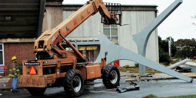 Oct. 3, 2015: he remains of a concrete canopy that collapsed sit in front of North Iredell High School in Olin, N.C.