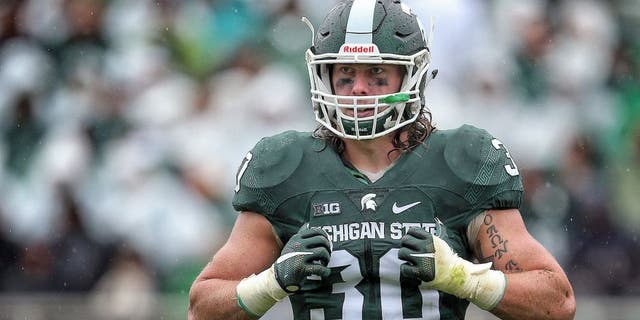 Oct 3, 2015; East Lansing, MI, USA; Michigan State Spartans linebacker Riley Bullough (30) looks to the sidelines during the 2nd half of a game against the Purdue Boilermakers at Spartan Stadium. MSU won 24-21. Mandatory Credit: Mike Carter-USA TODAY Sports