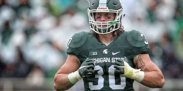 Oct 3, 2015; East Lansing, MI, USA; Michigan State Spartans linebacker Riley Bullough (30) looks to the sidelines during the 2nd half of a game against the Purdue Boilermakers at Spartan Stadium. MSU won 24-21. Mandatory Credit: Mike Carter-USA TODAY Sports