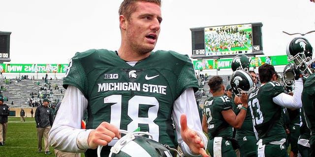 Oct 3, 2015; East Lansing, MI, USA; Michigan State Spartans quarterback Connor Cook (18) celebrates defeating the Purdue Boilermakers after a game at Spartan Stadium. Mandatory Credit: Mike Carter-USA TODAY Sports