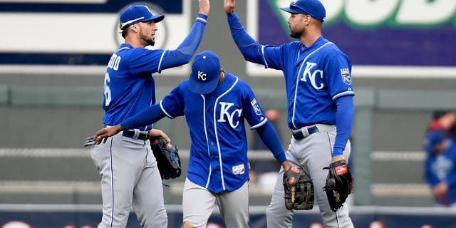 MINNEAPOLIS, MN - OCTOBER 4: (L-R) Paulo Orlando #16, Jarrod Dyson #1 and Alex Rios #15 of the Kansas City Royals celebrate a win of the game against the Minnesota Twins on October 4, 2015 at Target Field in Minneapolis, Minnesota. The Royals defeated the Twins 6-1. (Photo by Hannah Foslien/Getty Images)