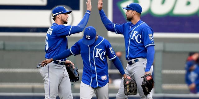 MINNEAPOLIS, MN - OCTOBER 4: (L-R) Paulo Orlando #16, Jarrod Dyson #1 and Alex Rios #15 of the Kansas City Royals celebrate a win of the game against the Minnesota Twins on October 4, 2015 at Target Field in Minneapolis, Minnesota. The Royals defeated the Twins 6-1. (Photo by Hannah Foslien/Getty Images)