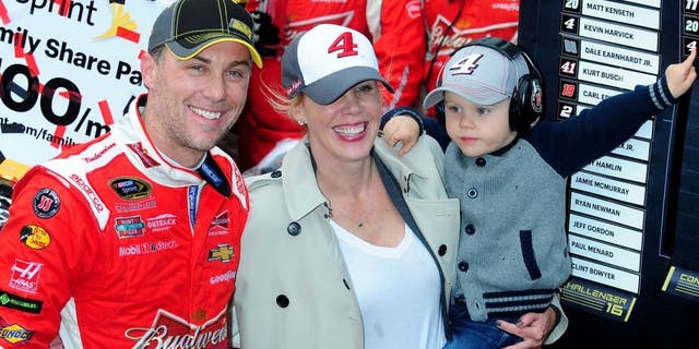 DOVER, DE - OCTOBER 04: Kevin Harvick, driver of the #4 Budweiser/Jimmy John's Chevrolet, wife DeLana and son Keelan celebrate in victory lane after winning the NASCAR Sprint Cup Series AAA 400 at Dover International Speedway on October 4, 2015 in Dover, Delaware. (Photo by Will Schneekloth/Getty Images)