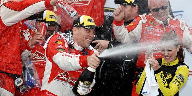 DOVER, DE - OCTOBER 04: Kevin Harvick, driver of the #4 Budweiser/Jimmy John's Chevrolet, celebrates in victory lane after winning the NASCAR Sprint Cup Series AAA 400 at Dover International Speedway on October 4, 2015 in Dover, Delaware. (Photo by Rainier Ehrhardt/NASCAR via Getty Images)