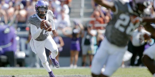 Oct 3, 2015; Fort Worth, TX, USA; Texas Christian University Horned Frogs quarterback Trevone Boykin (2) scrambles against the University of Texas Longhorns in the third quarter at Amon G. Carter Stadium. Mandatory Credit: Erich Schlegel-USA TODAY Sports