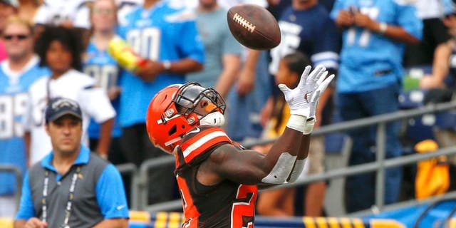Cleveland Browns running back Duke Johnson makes an end zone catch for a touchdown against the San Diego Chargers during the first half of an NFL football game, Sunday, Oct. 4, 2015, in San Diego. (AP Photo/Lenny Ignelzi)
