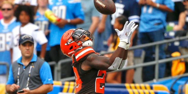 Cleveland Browns running back Duke Johnson makes an end zone catch for a touchdown against the San Diego Chargers during the first half of an NFL football game, Sunday, Oct. 4, 2015, in San Diego. (AP Photo/Lenny Ignelzi)