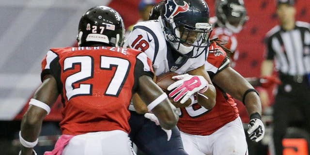 Houston Texans wide receiver Cecil Shorts (18) makes a catch for a touchdown against Atlanta Falcons defensive back Robenson Therezie (27) during the second half of an NFL football game, Sunday, Oct. 4, 2015, in Atlanta. (AP Photo/David Goldman)