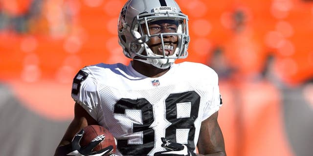 CLEVELAND, OH - OCTOBER 26: Cornerback T.J. Carrie #38 of the Oakland Raiders warms up prior to the game against the Cleveland Browns at FirstEnergy Stadium in Cleveland, Ohio. (Photo by Jason Miller/Getty Images)