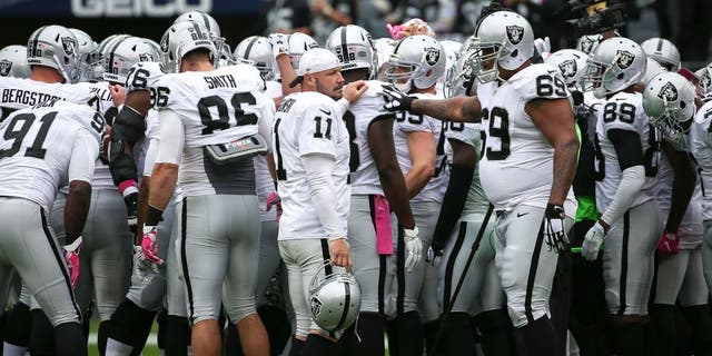 CHICAGO, IL - OCTOBER 04: The Oakland Raiders huddle up prior to the game against the Chicago Bears at Soldier Field on October 4, 2015 in Chicago, Illinois. (Photo by Jonathan Daniel/Getty Images)