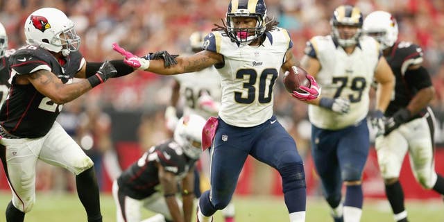 GLENDALE, AZ - OCTOBER 04: Running back Todd Gurley #30 of the St. Louis Rams runs past free safety Rashad Johnson #26 of the Arizona Cardinals during the second half of the NFL game at the University of Phoenix Stadium on October 4, 2015 in Glendale, Arizona. (Photo by Christian Petersen/Getty Images)