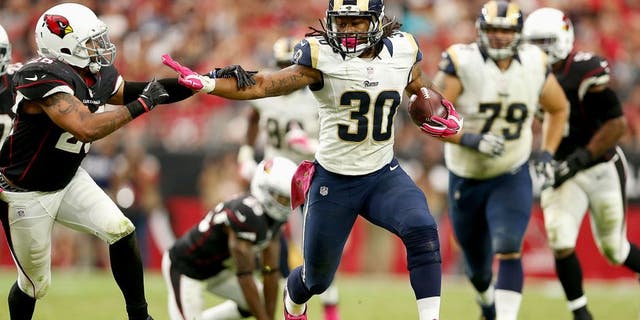 GLENDALE, AZ - OCTOBER 04: Running back Todd Gurley #30 of the St. Louis Rams runs past free safety Rashad Johnson #26 of the Arizona Cardinals during the second half of the NFL game at the University of Phoenix Stadium on October 4, 2015 in Glendale, Arizona. (Photo by Christian Petersen/Getty Images)