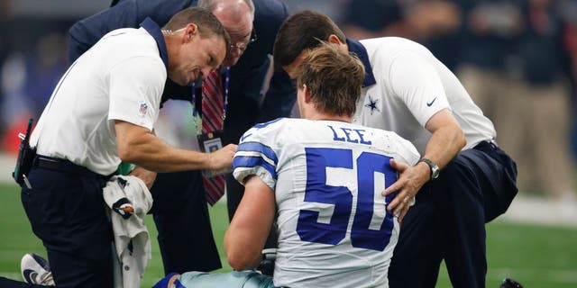 Sep 27, 2015; Arlington, TX, USA; Dallas Cowboys linebacker Sean Lee (50) is attended to after an injury in the third quarter against the Atlanta Falcons at AT&amp;T Stadium. Mandatory Credit: Matthew Emmons-USA TODAY Sports