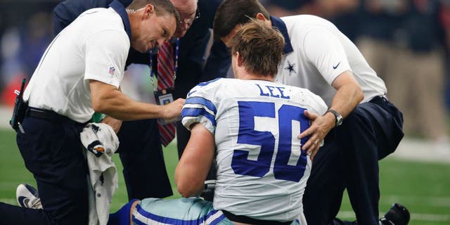 Sep 27, 2015; Arlington, TX, USA; Dallas Cowboys linebacker Sean Lee (50) is attended to after an injury in the third quarter against the Atlanta Falcons at AT&T Stadium. Mandatory Credit: Matthew Emmons-USA TODAY Sports