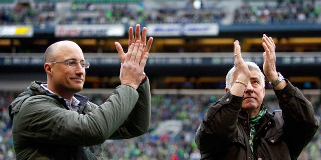Apr 26, 2015; Seattle, WA, USA; Hall of Fame inductees Seattle Sounders FC head coach Sigi Schmid, right, and Seattle Sounders FC former goalie Kasey Keller applaud the fans before a game against the Portland Timbers at CenturyLink Field. Seattle defeated Portland, 1-0. Mandatory Credit: Joe Nicholson-USA TODAY Sports