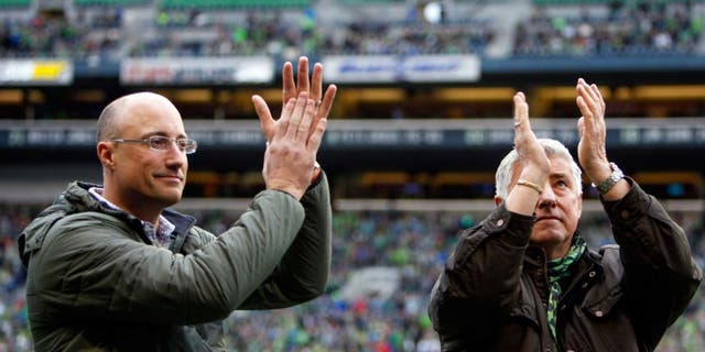 Apr 26, 2015; Seattle, WA, USA; Hall of Fame inductees Seattle Sounders FC head coach Sigi Schmid, right, and Seattle Sounders FC former goalie Kasey Keller applaud the fans before a game against the Portland Timbers at CenturyLink Field. Seattle defeated Portland, 1-0. Mandatory Credit: Joe Nicholson-USA TODAY Sports