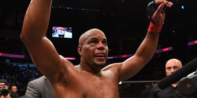 HOUSTON, TX - OCTOBER 03: Daniel Cormier celebrates his victory over Alexander Gustafsson in their UFC light heavyweight championship bout during the UFC 192 event at the Toyota Center on October 3, 2015 in Houston, Texas. (Photo by Josh Hedges/Zuffa LLC/Zuffa LLC via Getty Images)