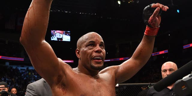 HOUSTON, TX - OCTOBER 03: Daniel Cormier celebrates his victory over Alexander Gustafsson in their UFC light heavyweight championship bout during the UFC 192 event at the Toyota Center on October 3, 2015 in Houston, Texas. (Photo by Josh Hedges/Zuffa LLC/Zuffa LLC via Getty Images)