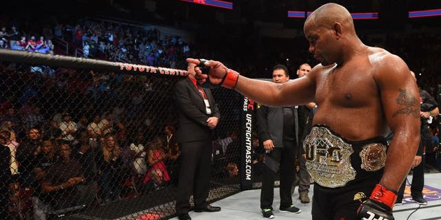 HOUSTON, TX - OCTOBER 03: Daniel Cormier celebrates his victory over Alexander Gustafsson in their UFC light heavyweight championship bout during the UFC 192 event at the Toyota Center on October 3, 2015 in Houston, Texas. (Photo by Josh Hedges/Zuffa LLC/Zuffa LLC via Getty Images)