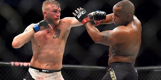 HOUSTON, TX - OCTOBER 03: (L-R) Alexander Gustafsson punches Daniel Cormier in their UFC light heavyweight championship bout during the UFC 192 event at the Toyota Center on October 3, 2015 in Houston, Texas. (Photo by Jeff Bottari/Zuffa LLC/Zuffa LLC via Getty Images)