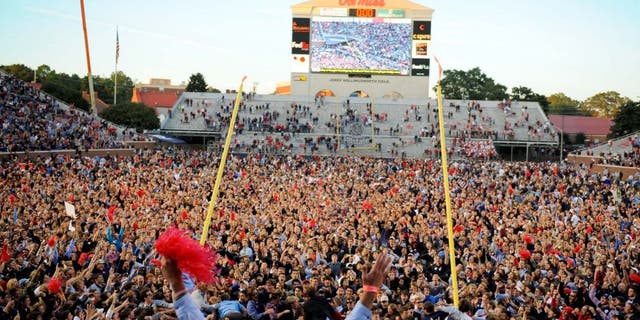 Oct 4, 2014; Oxford, MS, USA; Mississippi Rebels fans tear down the goal posts after a win against the Alabama Crimson Tide at Vaught-Hemingway Stadium. The Rebels won 23-17. Mandatory Credit: Christopher Hanewinckel-USA TODAY Sports