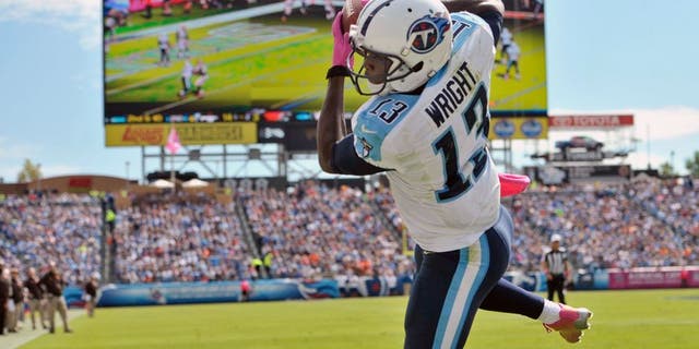 Oct 5, 2014; Nashville, TN, USA; Tennessee Titans wide receiver Kendall Wright (13) catches a touchdown pass against the Cleveland Browns during the first half at LP Field. Mandatory Credit: Jim Brown-USA TODAY Sports