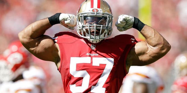 SANTA CLARA, CA - OCTOBER 05: Michael Wilhoite #57 of the San Francisco 49ers flexes his muscles after making a tackled during their game against the Kansas City Chiefs at Levi's Stadium on October 5, 2014 in Santa Clara, California. (Photo by Ezra Shaw/Getty Images)