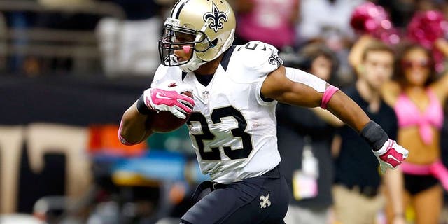 NEW ORLEANS, LA - OCTOBER 05: Pierre Thomas #23 of the New Orleans Saints rushes for a touchdown during the fourth quarter of a game against the Tampa Bay Buccaneers at the Mercedes-Benz Superdome on October 5, 2014 in New Orleans, Louisiana. (Photo by Wesley Hitt/Getty Images)