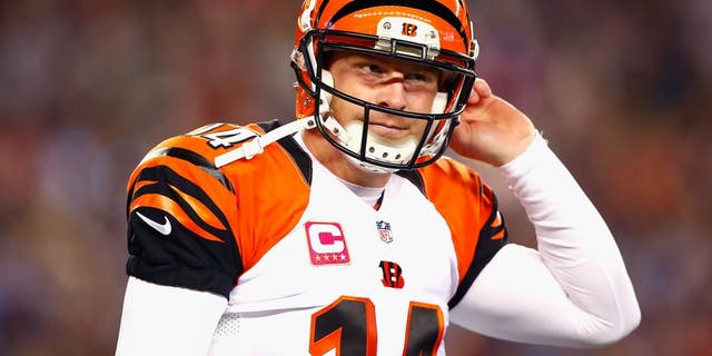 FOXBORO, MA - OCTOBER 05: Andy Dalton #14 of the Cincinnati Bengals reacts during the second quarter against the New England Patriots at Gillette Stadium on October 5, 2014 in Foxboro, Massachusetts. (Photo by Jared Wickerham/Getty Images)
