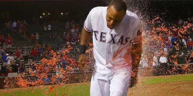 ARLINGTON, TX - SEPTEMBER 29: Adrian Beltre #29 of the Texas Rangers is soaked with PowerAid after the Rangers beat the Detroit Tigers 7-6 at Globe Life Park in Arlington on September 29, 2015 in Arlington, Texas. (Photo by Tom Pennington/Getty Images)