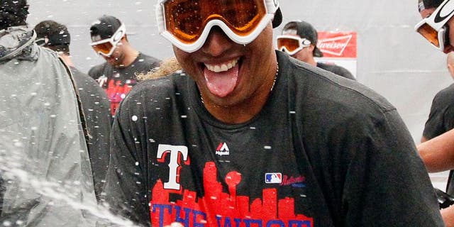 ARLINGTON, TX - OCTOBER 4: Leonys Martin of the Texas Rangers celebrates winning the team's sixth AL West Title after a baseball game against the Los Angeles Angels at Globe Life Park on October 4, 2015 in Arlington, Texas. Texas won 9-2. (Photo by Brandon Wade/Getty Images)