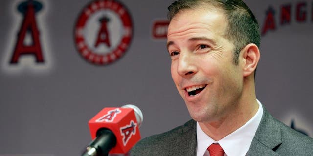 Longtime Yankees executive Billy Eppler smiles during a news conference announcing him as the new general manager for the Los Angeles Angels in Anaheim, Calif., Monday, Oct. 5, 2015. The 40-year-old Eppler replaces interim GM Bill Stoneman, who took over after Jerry Dipoto quit his job at midseason following his latest disagreement with Mike Scioscia, the longest-serving manager in baseball. (AP Photo/Nick Ut)
