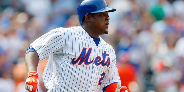 NEW YORK, NY - AUGUST 30: Juan Uribe #2 of the New York Mets in action against the bb at Citi Field on August 30, 2015 in the Flushing neighborhood of the Queens borough of New York City. The Mets defeated the Red Sox 5-4. (Photo by Jim McIsaac/Getty Images)