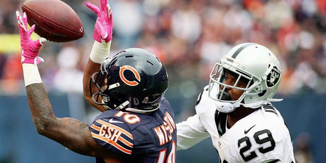 CHICAGO, IL - OCTOBER 04: Marquess Wilson #10 of the Chicago Bears hauls in a pass on the last Bears possession of the game in front of David Amerson #29 of the Oakland Raiders at Soldier Field on October 4, 2015 in Chicago, Illinois. The Bears defeated the Raiders 22-20. (Photo by Jonathan Daniel/Getty Images)
