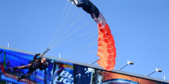 Dec 8, 2013; Denver, CO, USA; General view of a sky diver performer coming into Sports Authority Field at Mile High.before the game Tennessee Titans against the Denver Broncos. Mandatory Credit: Ron Chenoy-USA TODAY Sports