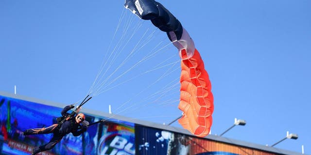 Dec 8, 2013; Denver, CO, USA; General view of a sky diver performer coming into Sports Authority Field at Mile High.before the game Tennessee Titans against the Denver Broncos. Mandatory Credit: Ron Chenoy-USA TODAY Sports