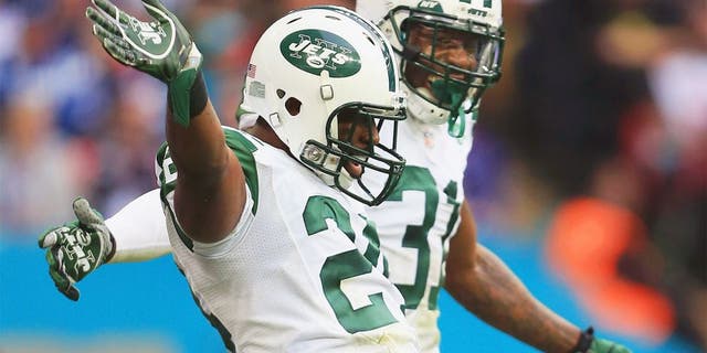 LONDON, ENGLAND - OCTOBER 04: Darrelle Revis #24 of the New York Jets celebrates his interception with Antonio Cromartie #31 of the New York Jets during the game against Miami Dolphins at Wembley Stadium on October 4, 2015 in London, England. (Photo by Stephen Pond/Getty Images)