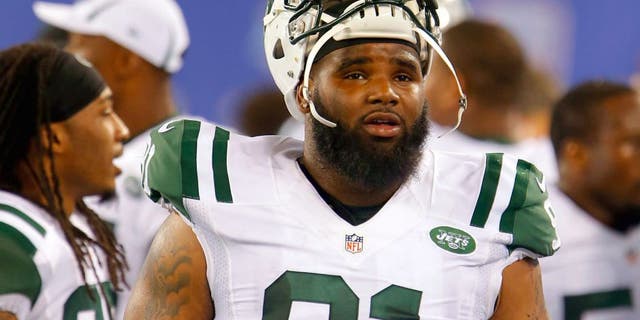 Aug 29, 2015; East Rutherford, NJ, USA; New York Jets defensive end Sheldon Richardson (91) on the sidelines during the second half against the New York Giants at MetLife Stadium. Mandatory Credit: Noah K. Murray-USA TODAY Sports