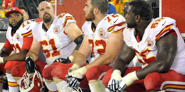Sep 28, 2015; Green Bay, WI, USA; Kansas City Chiefs offensive tackle Jeff Allen (71), center Mitch Morse (61), offensive tackle Eric Fisher (72) and guard Ben Grubbs (66) watch the final minutes of the game against the Green Bay Packers at Lambeau Field. Mandatory Credit: Benny Sieu-USA TODAY Sports