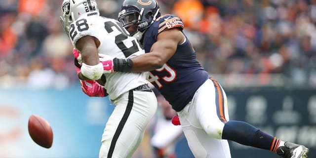 Oct 4, 2015; Chicago, IL, USA; Chicago Bears defensive end Sam Acho (49) breaks up a pass intended for Oakland Raiders running back Latavius Murray (28) during the second half at Soldier Field. Mandatory Credit: Jerry Lai-USA TODAY Sports