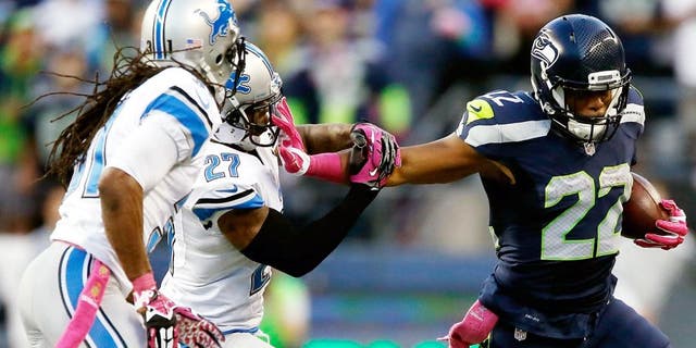 SEATTLE, WA - OCTOBER 05: Fred Jackson #22 of the Seattle Seahawks carries the ball as Glover Quin #27 of the Detroit Lions defends during the first half of their game at CenturyLink Field on October 5, 2015 in Seattle, Washington. (Photo by Otto Greule Jr/Getty Images)