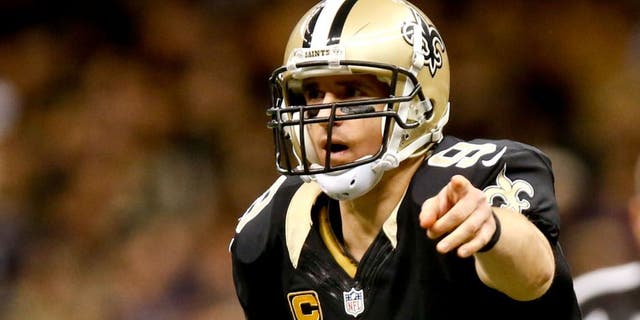 Nov 24, 2014; New Orleans, LA, USA; New Orleans Saints quarterback Drew Brees (9) against the Baltimore Ravens during the second half of a game at the Mercedes-Benz Superdome. The Ravens defeated the Saints 34-27. Mandatory Credit: Derick E. Hingle-USA TODAY Sports