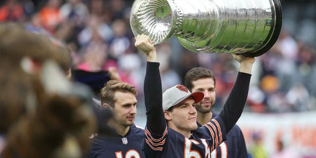 CHICAGO, IL - OCTOBER 04: Andrew Shaw #65 of the Chicago Blackhawks holds up the Stanley Cup prior to the NFL game between the Chicago Bears and the Oakland Raiders at Soldier Field on October 4, 2015 in Chicago, Illinois. The Chicago Bears defeated the Oakland Raiders 22-20. (Photo by Jonathan Daniel/Getty Images)
