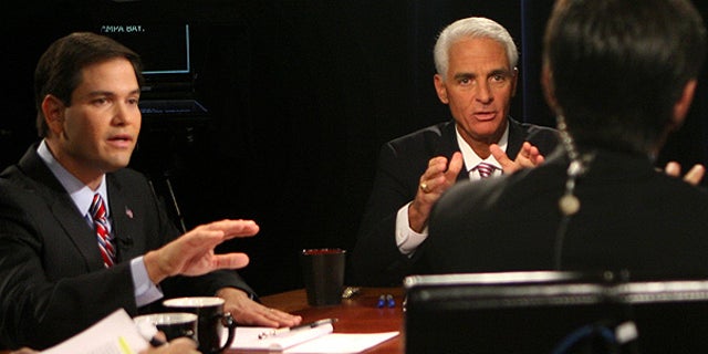 Oct. 6: Moderator George Stephanopoulos, foreground, tries to keep order during a contentious point with Senate candidates Marco Rubio, left, Charlie Crist and Kendrick Meek (unseen), during their debate in Orlando.